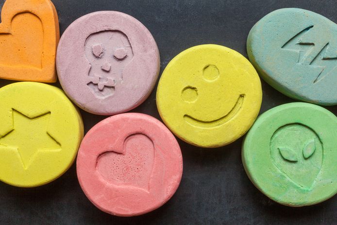 Ecstasy tablets on black background stockadr xtc ectasy drugs