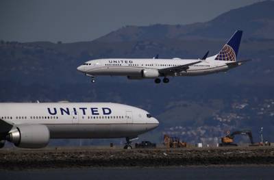 United Airlines plane avoids collision during descent to San Francisco: Two passengers injured