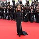 Ook dit is de mens: Isabelle Huppert in Cannes en een voetbalsupporter met een brandende rookbom in zijn kont