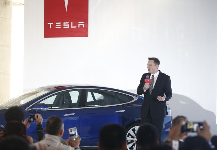 Topman Elon Musk tijdens een persconferentie in China.