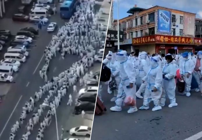 Honderden coronapatiënten in hazmat-pak per bus weggeleid in China