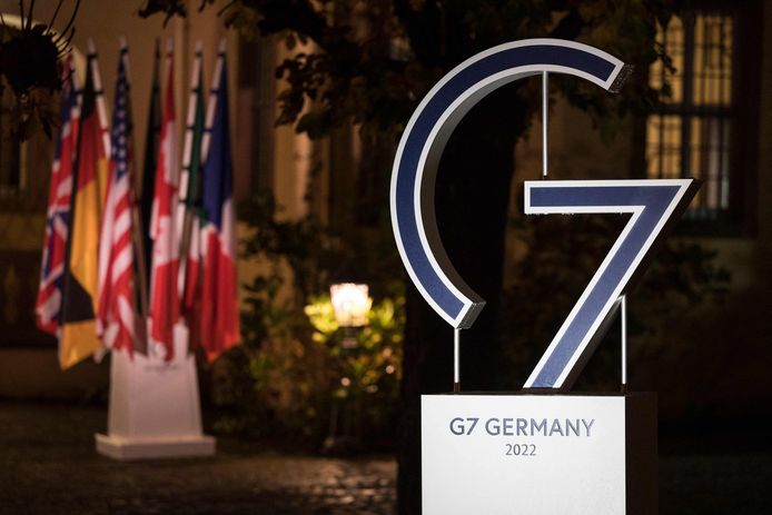 A Logo of the G7 with national flags in the background are pictured during a G7 Interior Ministers Meeting in the wine estate Schloss Vollrads in Oestrich-Winkel, western Germany, on November 17, 2022. (Photo by Hannes P Albert / POOL / AFP)