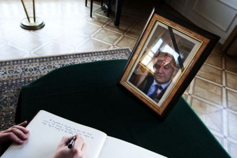 Foto van de Poolse president Lech Kaczynski bij een condoleanceregister. ANP Beeld 
