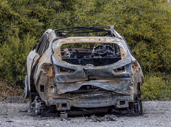 The killers' burned-out car was found further away.
