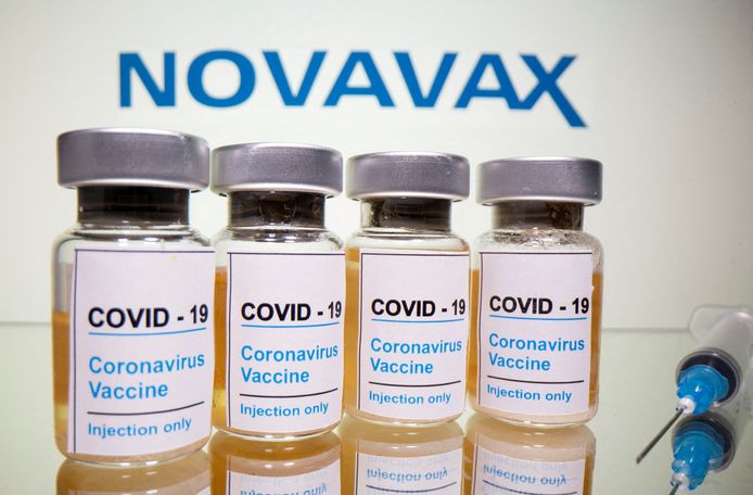 FILE PHOTO: FILE PHOTO: Vials with a sticker reading, "COVID-19 / Coronavirus vaccine / Injection only" and a medical syringe are seen in front of a displayed Novavax logo in this illustration taken October 31, 2020. REUTERS/Dado Ruvic/Illustration/File Photo/File Photo