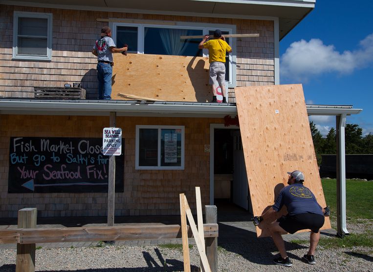 On the east coast, residents are taking measures to protect their homes and shops against the approaching hurricane.  Image EPA