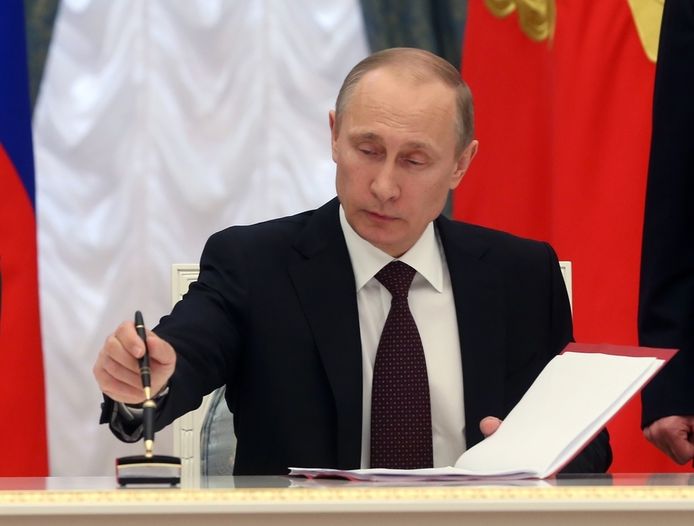 Poetin bij de ondertekening van het verdrag waarmee hij de Krim annexeerde.