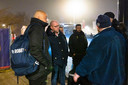Hoofdtrainer Fred Grim in gesprek met enkele van de circa honderd ontevreden Willem II-supporters die de spelersbus opwachtten na de 2-0 nederlaag bij PEC Zwolle.