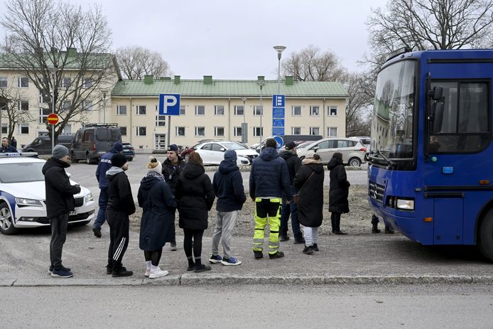 Police officers talk to family members of pupils at the Viertola comprehensive school in Vantaa, Finland, on April 2, 2024. Three minors were injured in a shooting at the school on Tuesday morning. A suspect, also a minor, has been apprehended.   Lehtikuva/MARKKU ULANDER  via REUTERS      ATTENTION EDITORS - THIS IMAGE WAS PROVIDED BY A THIRD PARTY. NO THIRD PARTY SALES. NOT FOR USE BY REUTERS THIRD PARTY DISTRIBUTORS. FINLAND OUT. NO COMMERCIAL OR EDITORIAL SALES IN FINLAND.
