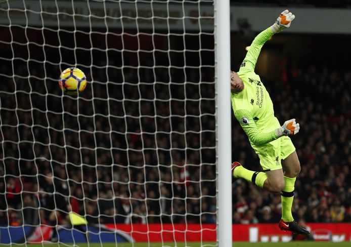 Arsenal's Swiss midfielder Granit Xhaka (unseen) scores past Liverpool's Belgian goalkeeper Simon Mignolet during the English Premier League football match between Arsenal and Liverpool at the Emirates Stadium in London on December 22, 2017.  / AFP PHOTO / Adrian DENNIS / RESTRICTED TO EDITORIAL USE. No use with unauthorized audio, video, data, fixture lists, club/league logos or 'live' services. Online in-match use limited to 75 images, no video emulation. No use in betting, games or single club/league/player publications.  /