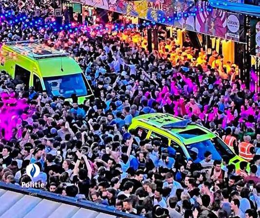 Aid workers' cars in the crowd