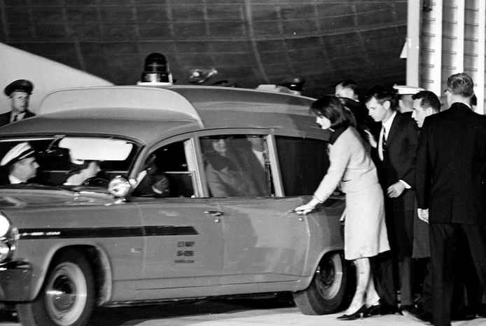 Widow Jackie Kennedy then entered the hearse that would transport her husband from the Air Force Base in Maryland to the White House.  Her socks and clothes were still dirty.  With her was the brother of the assassinated president, Robert Kennedy.