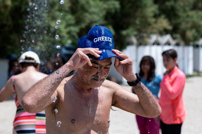 A swimmer takes a bath in Athens, Greece.