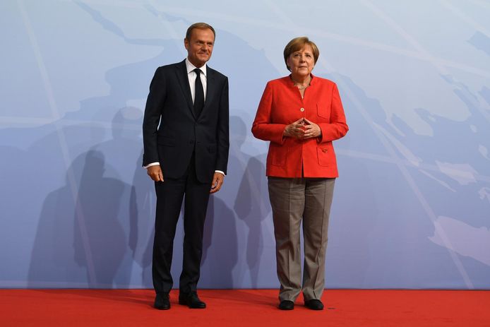 Donald Tusk en Angela Merkel.