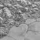 Ook op Pluto schittert de blanke top der duinen