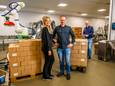 Ruiten Foodpack in Roelofarendsveen: nieuwe generatie Angelique en Erwin van Ruiten met robot, rechts vader Hans.