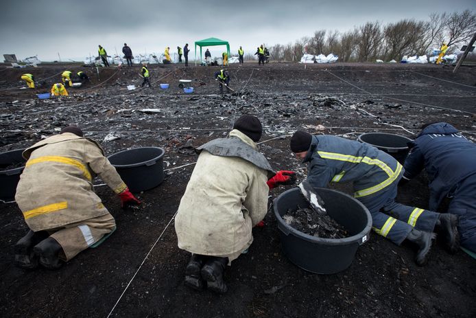 The burn site in Hrabove, Ukraine.  In the background, the Dutch team is carrying out trace research.