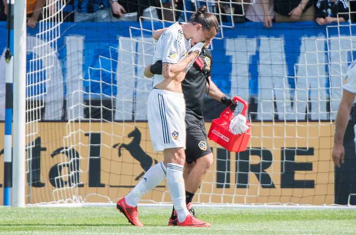 L.A. Galaxy's Zlatan Ibrahimovic is helped off the pitch during first-half MLS soccer game action against the Montreal Impact in Montreal, Monday, May 21, 2018. (Graham Hughes/The Canadian Press via AP)