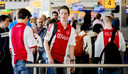 Supporters van Ajax op Schiphol voor vertrek naar Stockholm.