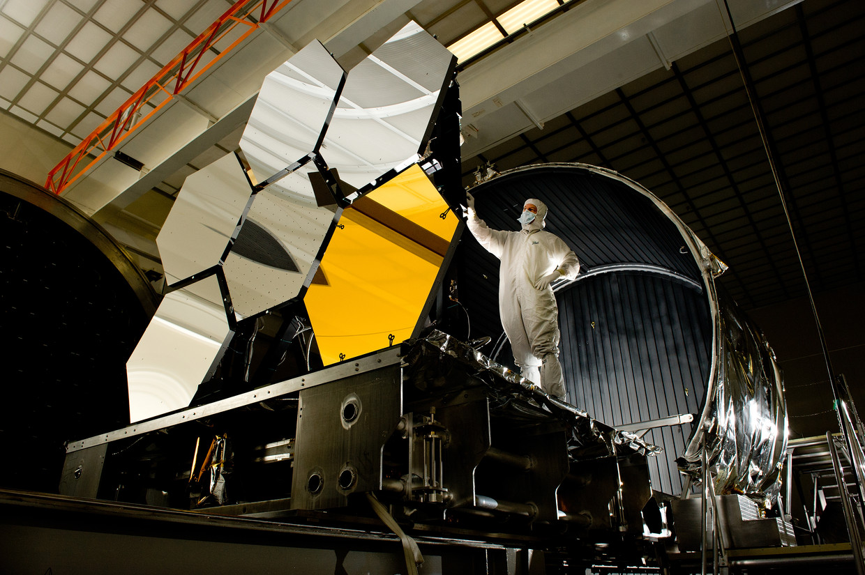 An engineer inspects the mirror parts of the James Webb Space Telescope.  Image by David Higginbotham/NASA/MSFC