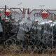 Polen zet waterkanonnen en traangas in om migranten aan grens tegen te houden