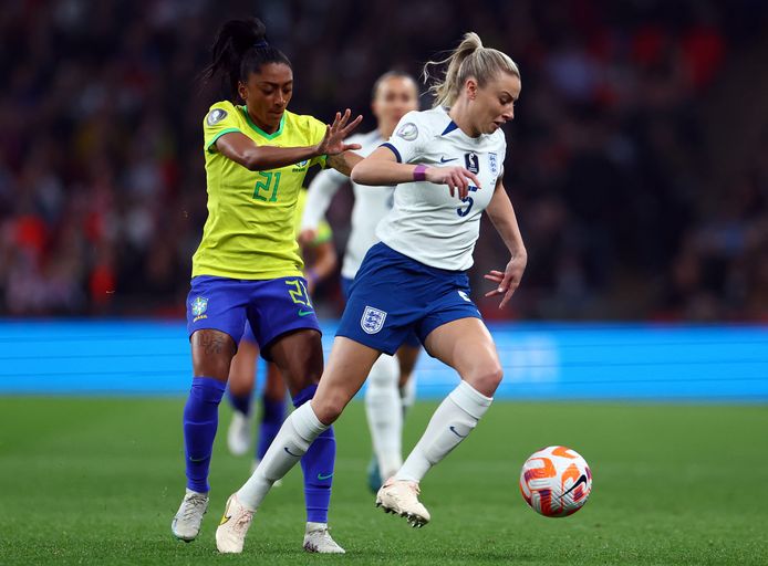 England captain Leah Williamson takes on Brazil's Caroline Nicoli.