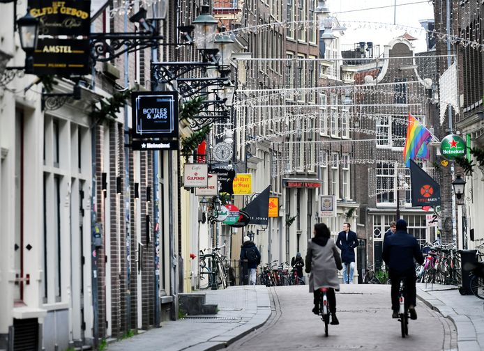 People ride bikes on an empty street as Netherlands has gone into lockdown as the spread of the coronavirus disease (COVID-19) continues in Amsterdam, Netherlands December 15 2020, REUTERS/Piroschka van de Wouw