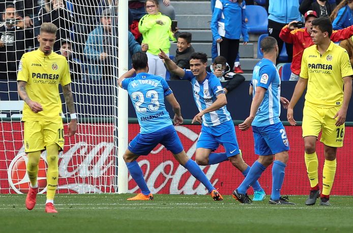 Chory Castro viert met zijn Malaga-ploegmaats na de 1-0 tegen Villarreal.
