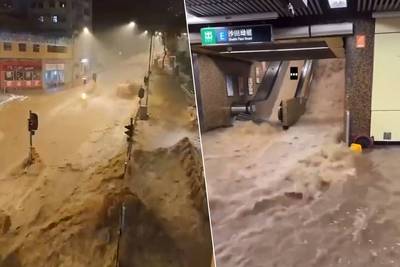 KIJK. Wolkbreuk doet straten in woeste rivieren veranderen in Hongkong: nooit zo veel neerslag gevallen in één uur tijd