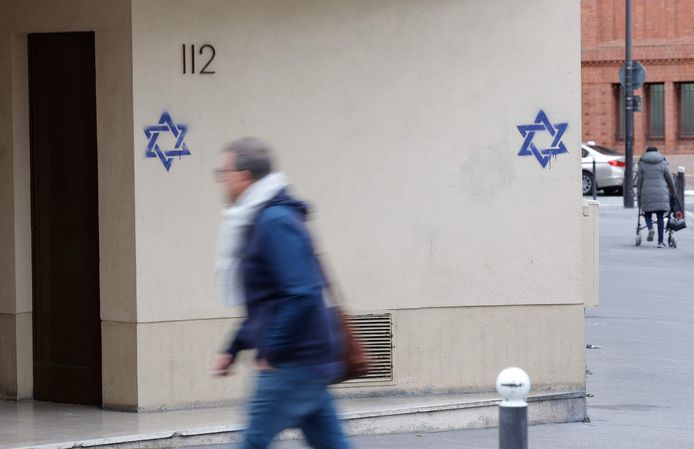 A defaced facade with a Star of David in Paris.