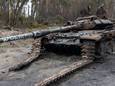 Scavengers search for useful metal parts in a destroyed Russian tank outside Kyiv, Ukraine, April 20, 2022. REUTERS/Jorge Silva