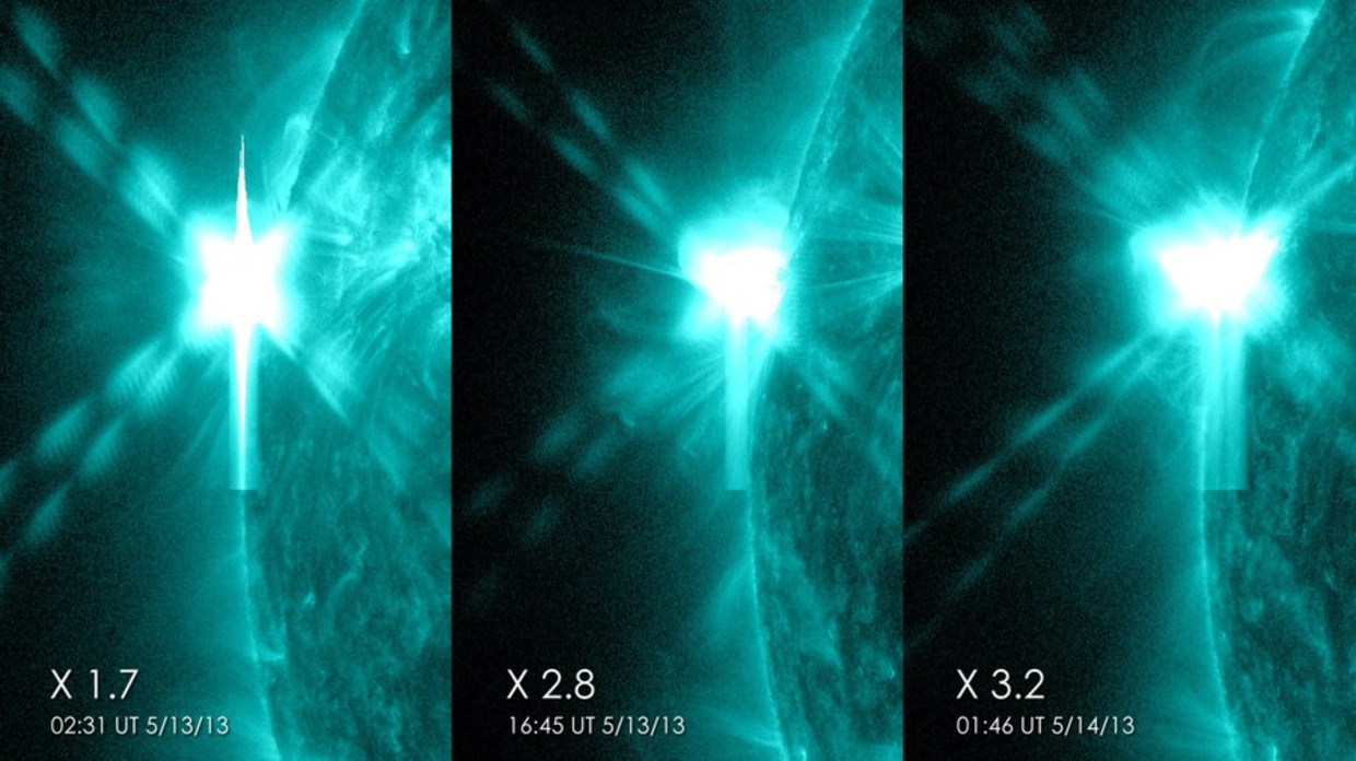 De drie X-klasse zonnevlammen die de zon binnen 24 uur tijd produceerde op 12 en 13 mei 2013. Beeld AFP