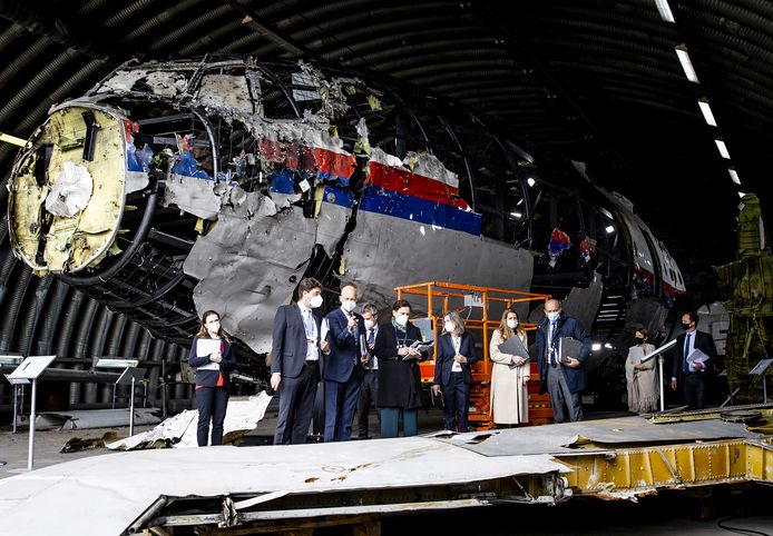 Members of the court and lawyers view the reconstruction of the MH17 plane that was shot down in 2014 at Gilze-Rijen Air Base.
