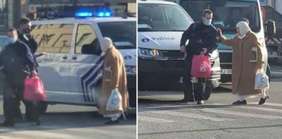 La belle image de la semaine: un policier bruxellois bloque la circulation pour aider une dame à traverser