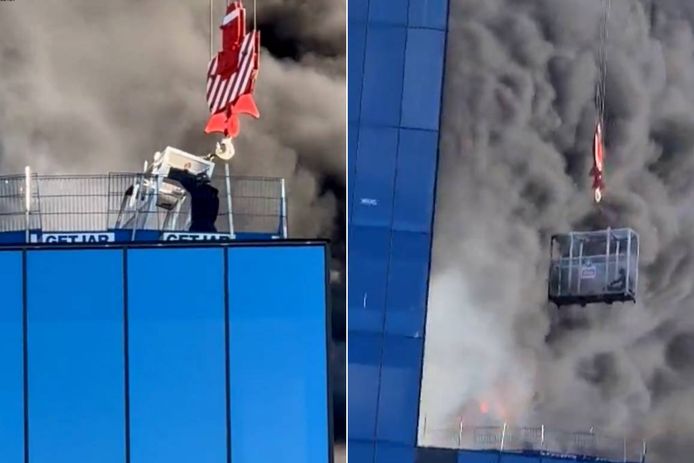 Рабочий спасается от сильного пожара в Ридинге с помощью крана
