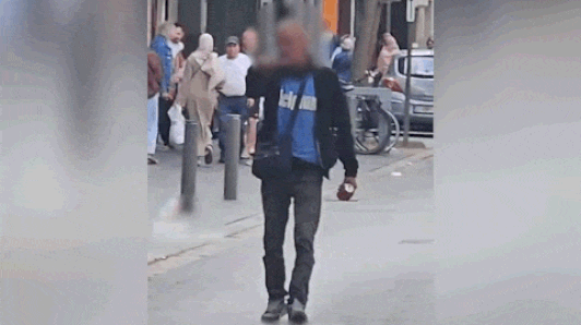 Man loopt met bijl in hand over straat in Antwerpen: buurtbewoners grijpen in