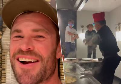 Dansen op stoelen én gooien met eten: Chris Hemsworth beleeft feestelijke avond op restaurant