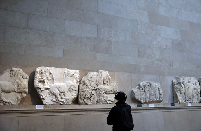 A visitor to the British Museum in London admires parts of the Parthenon sculptures.