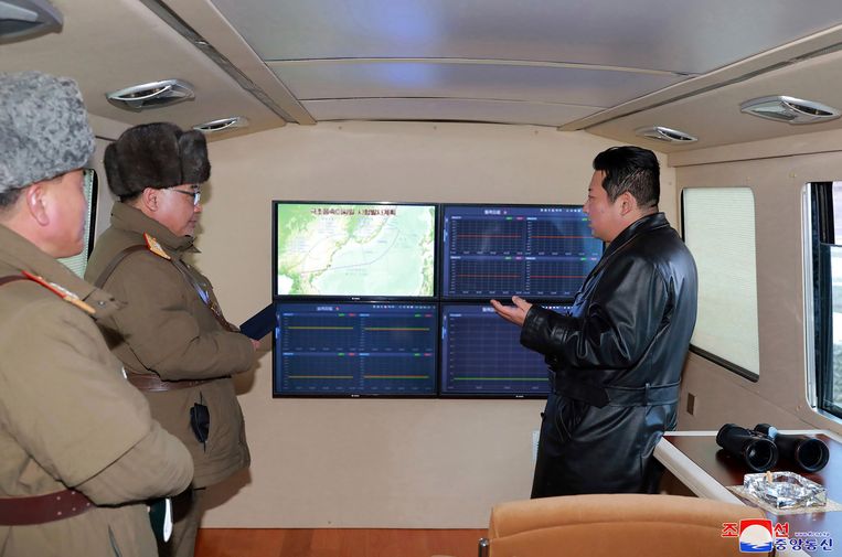 Kim Jong-un (right) follows the test launch of the hypersonic missile through a monitor.  Image AP