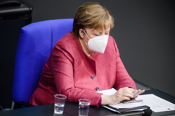 epa09138819 German Chancellor Angela Merkel wears a face mask as she looks on during a session of the German parliament Bundestag in Berlin, Germany, 16 April 2021. The German parliament consults about a change of the Protection against Infection Act(Infektionsschutzgesetz). With the changes discussed, the federal government shall be granted with more power regarding the enforcement of Coronavirus measures in the federal states.  EPA/CLEMENS BILAN