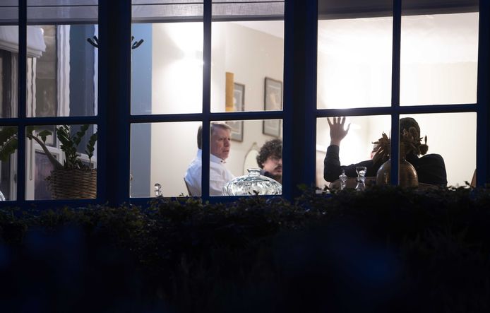 LTO foreman Sjaak van der Tak (left) and Roy Meijer of the NAJK (with glasses) are visible from a window in Villa Ockenburgh during the nightly consultations about the agricultural agreement.