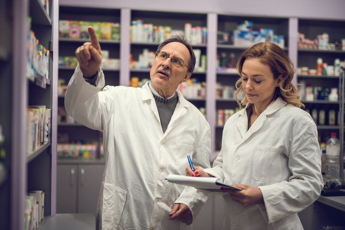 Two pharmacist doing medicine checklist at the pharmacy