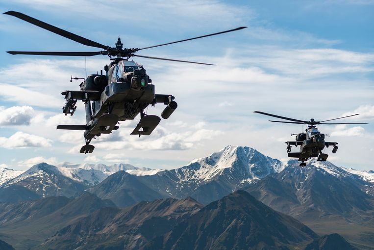 Two American AH-64D Apache Longbow helicopters near Fort Wainwright, Alaska.  On Thursday, two helicopters of the same type crashed while returning from a training flight.  Three soldiers were killed.  A.P.'s photo