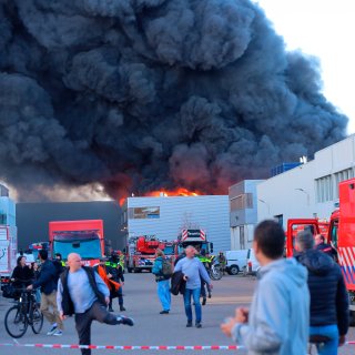 Major fire at scooter company under control, firefighters damping down