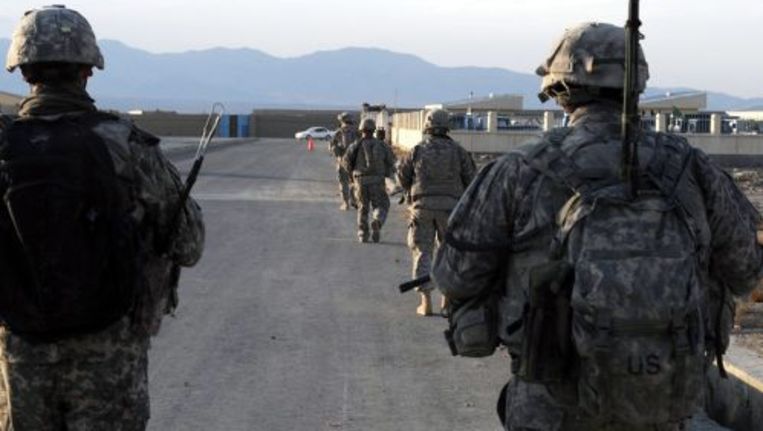 Amerikaanse soldaten op patrouille in Afghanistan. De Taliban-beweging heeft beelden vrijgegeven van een ontvoerde Amerikaanse militair. ANP Beeld 