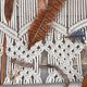 Werkbeschrijving macramé wandgordijn