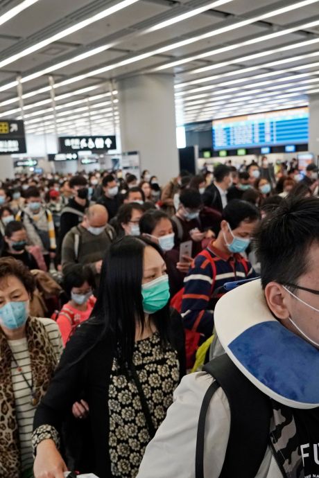 Virus: une deuxième ville de Chine en quarantaine, “alerte elevée” à Hong Kong