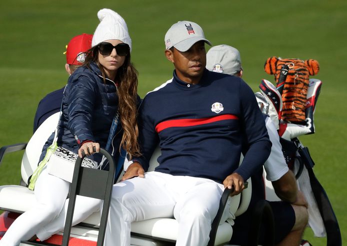 Tiger Woods met links zijn vriendin Erica Herman.
