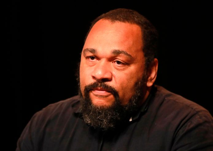 (FILES) In this file photo taken on May 20, 2017, French controversial humorist Dieudonne Mbala Mbala looks on during a press conference at the Theatre de la Main d'Or in Paris. - Dieudonné on July 5, 2019 was sentenced to two years in prison for tax fraud, abuse of corporate assets and money laundering. (Photo by JACQUES DEMARTHON / AFP)