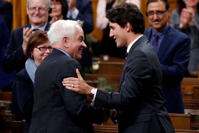 FILE PHOTO: Canada's Prime Minister Justin Trudeau (R) shakes hands with former Immigration Minister John McCallum after McCallum delivered his farewell speech in the House of Commons on Parliament Hill in Ottawa, Ontario, Canada, January 31, 2017. REUTERS/Chris Wattie/File Photo